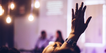 Person with their hand raised